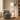 Seoul wood-tray floor lamp in a quiet reading corner, lamp on, wood tray visible.