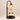 Three-quarter view of the matte black candle warmer, shade lit