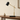 Black marble desk lamp on a console with one ceramic vase, shade on