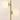 Close-up of the cream glass globes and gold branch joints, lit