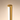Closeup of the gold housing and glowing white LED diffuser