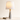 Marble Cone table lamp with a hardcover book at the foot for scale, lamp on