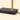 Close-up of the black marble block base, brass sleeve, and black cord