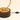 Close-up of the dark wood cylinder, gold plate, and black cord with inline rocker