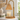 Amber Glass Tree Candle Warmer Lamp switched off on a white shelf in daylight