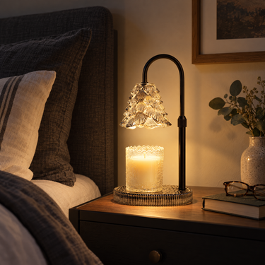 Clear Glass Tree Candle Warmer Lamp on a black nightstand at night