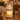 Close-up of the clear glass tree shade over a candle with melted wax