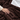 Close-up of a hand on the plush coffee flannel with the white reverse showing