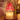 Close-up of the pink glass tree shade over a candle with melted wax