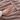 Close-up of a hand on the taupe flannel heated blanket